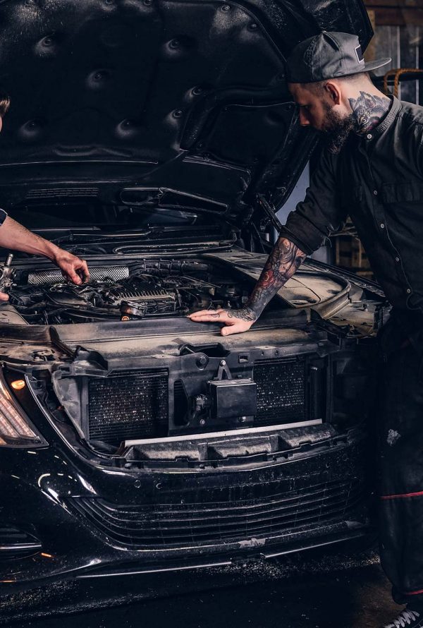 two-bearded-auto-mechanic-working-in-repair-garage-small.jpg